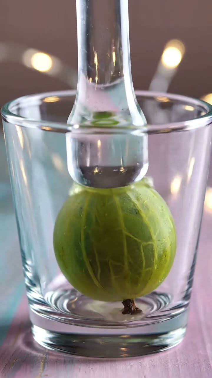 AI-generated ASMR video frame: Frozen gooseberry