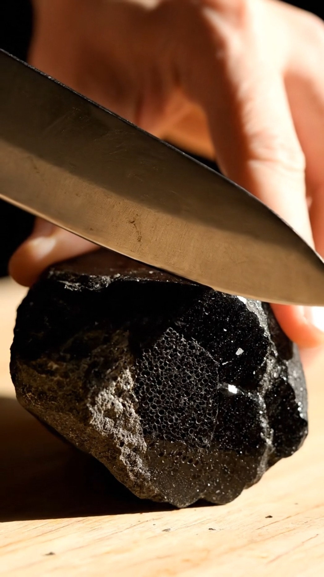 AI-generated ASMR video frame: “Obsidian” made of layered plastic