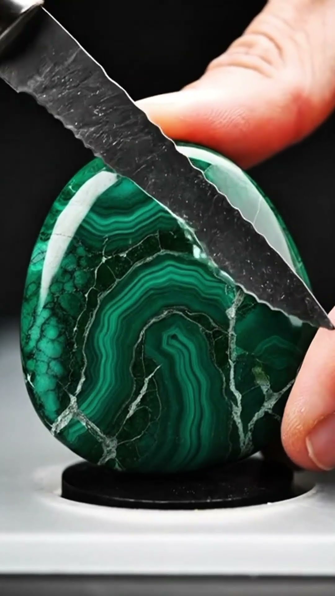 AI-generated ASMR video frame: Polished malachite, cut across the banding