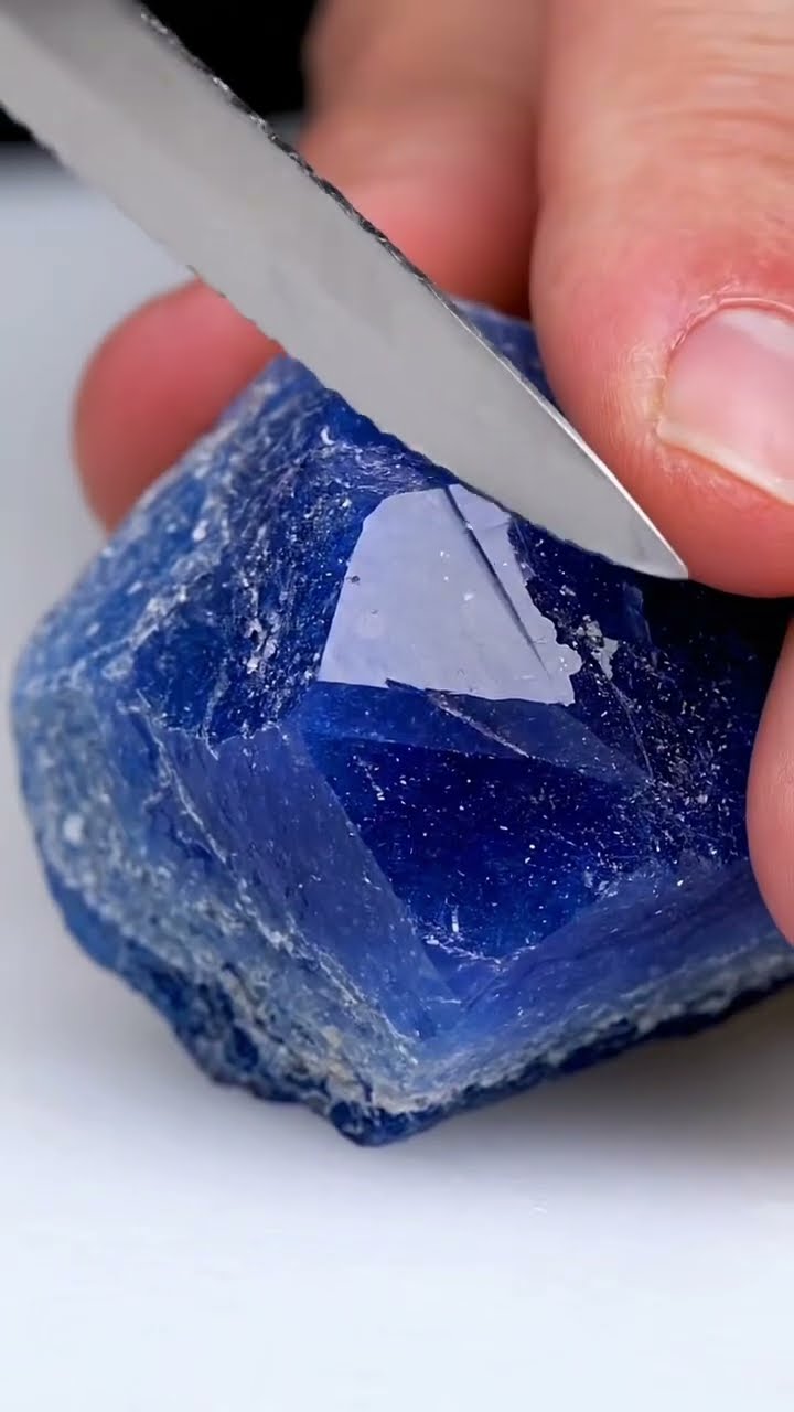 AI-generated ASMR video frame: Sapphire, serrated bread knife